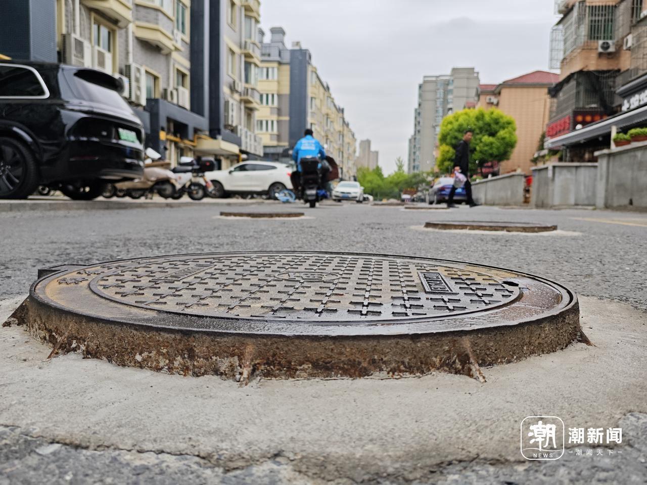 杭州一小区井盖密集，竟达 50 个之多，凸起的井盖是否影响通行？记者实地探访  第3张